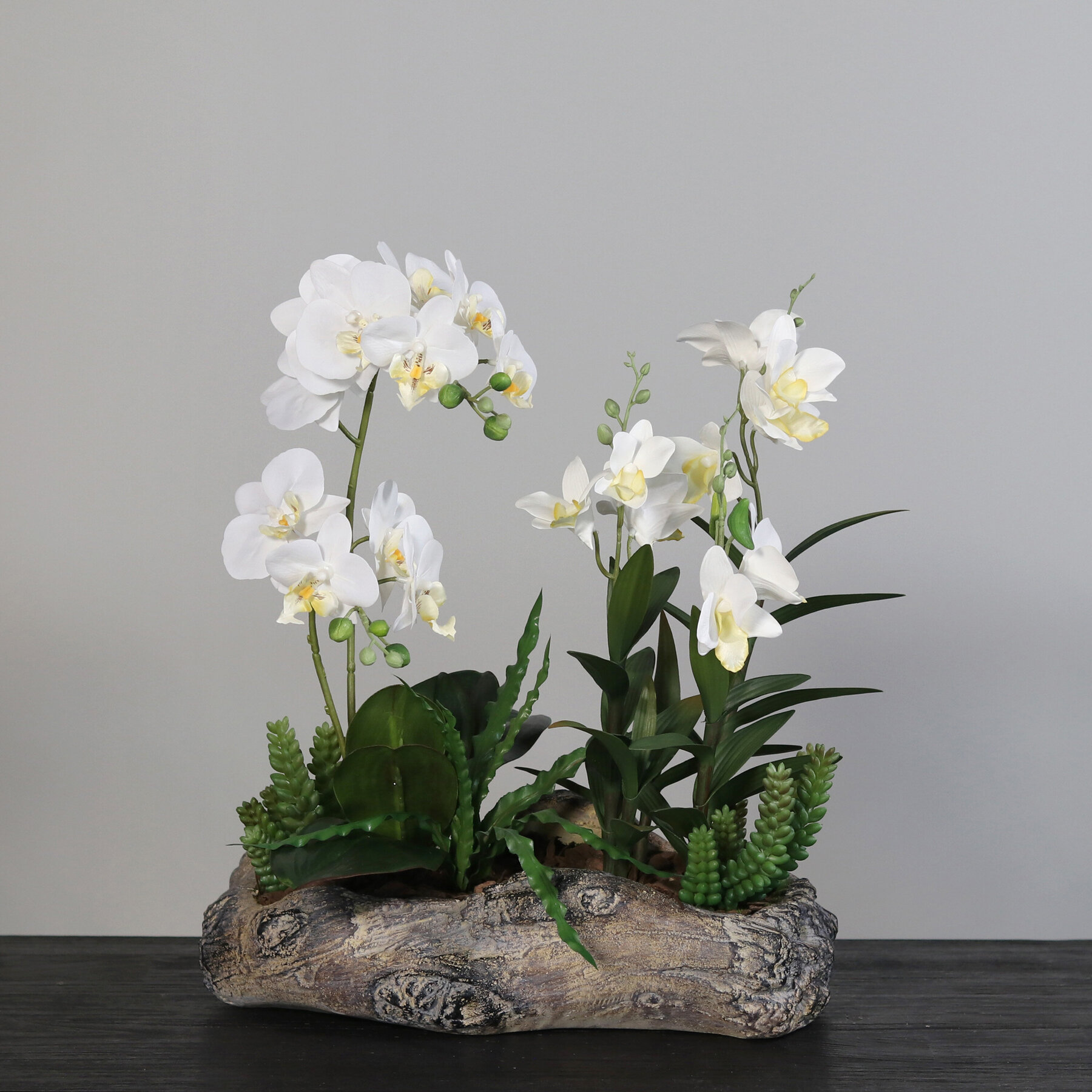 Künstliche Orchideen in Holz Schale